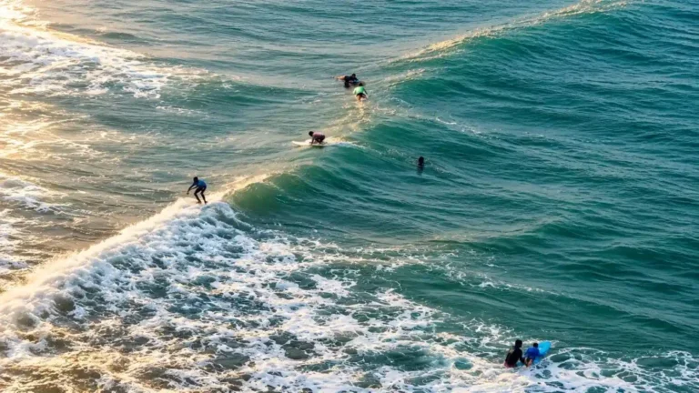 Surfers riding waves at Arugam Bay, featured by Air Lines Crew Tours