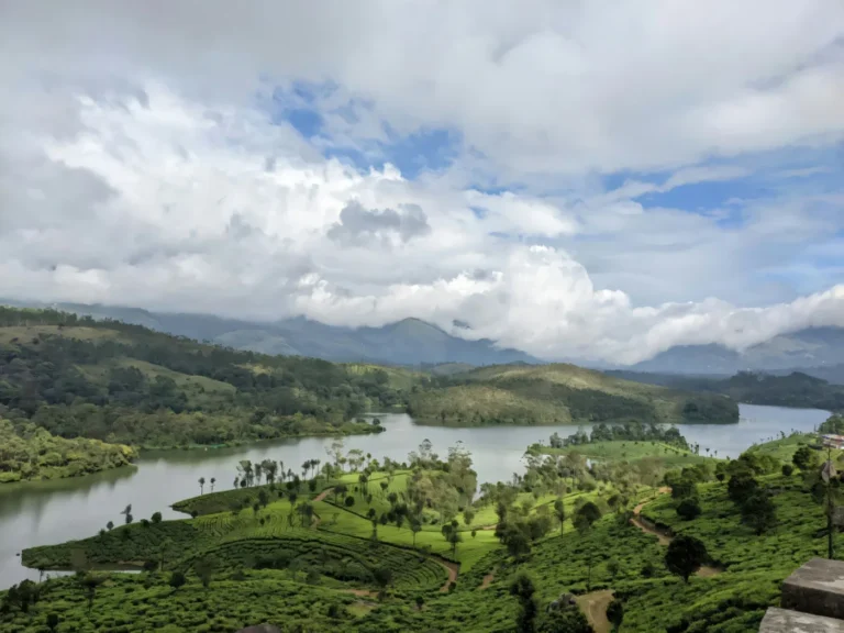 Lake and green hills beneath a cloudy sky in Sri Lanka