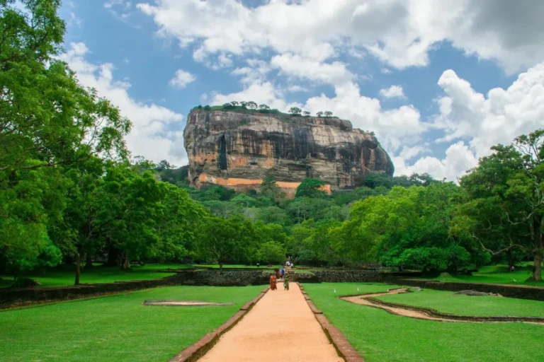 Path through the green gardens leading toward Sigiriya rock