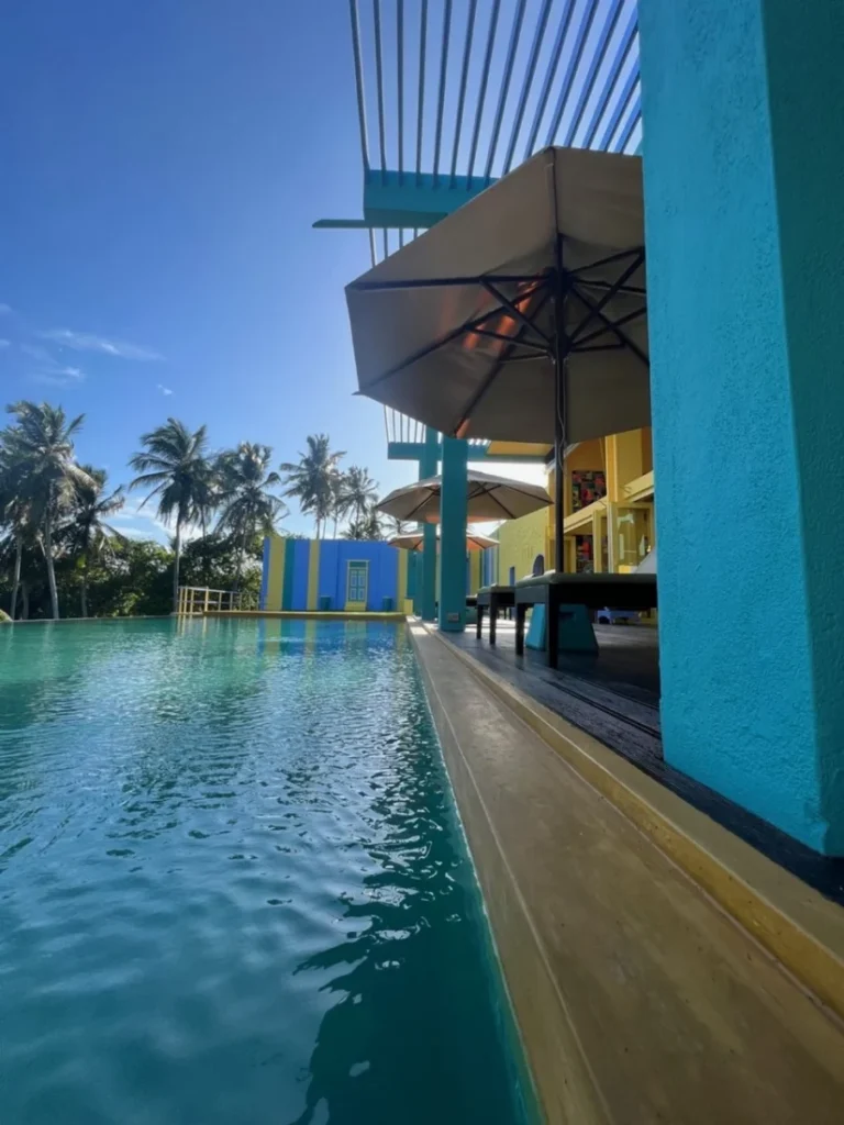 Swimming pool beside the colourful building at Buckingham Place