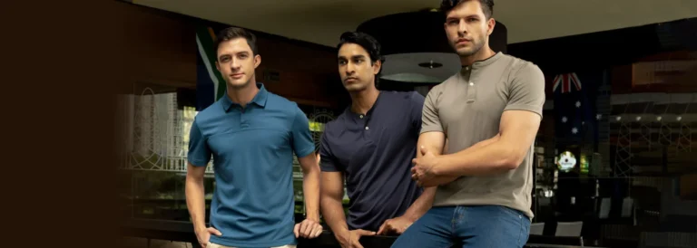 Three models wearing blue, navy and taupe Emerald polo shirts