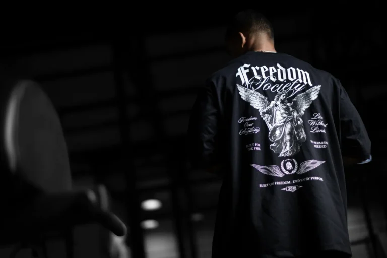 Back view of a black graphic T-shirt from FOA’s printed collection