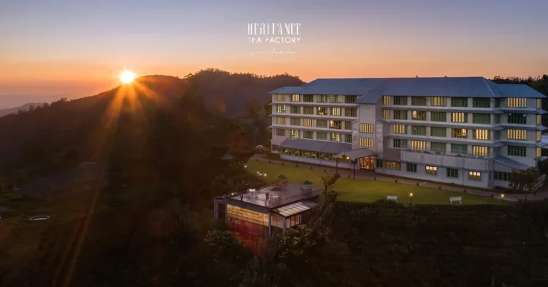 Heritance Tea Factory hotel overlooking hills at sunset